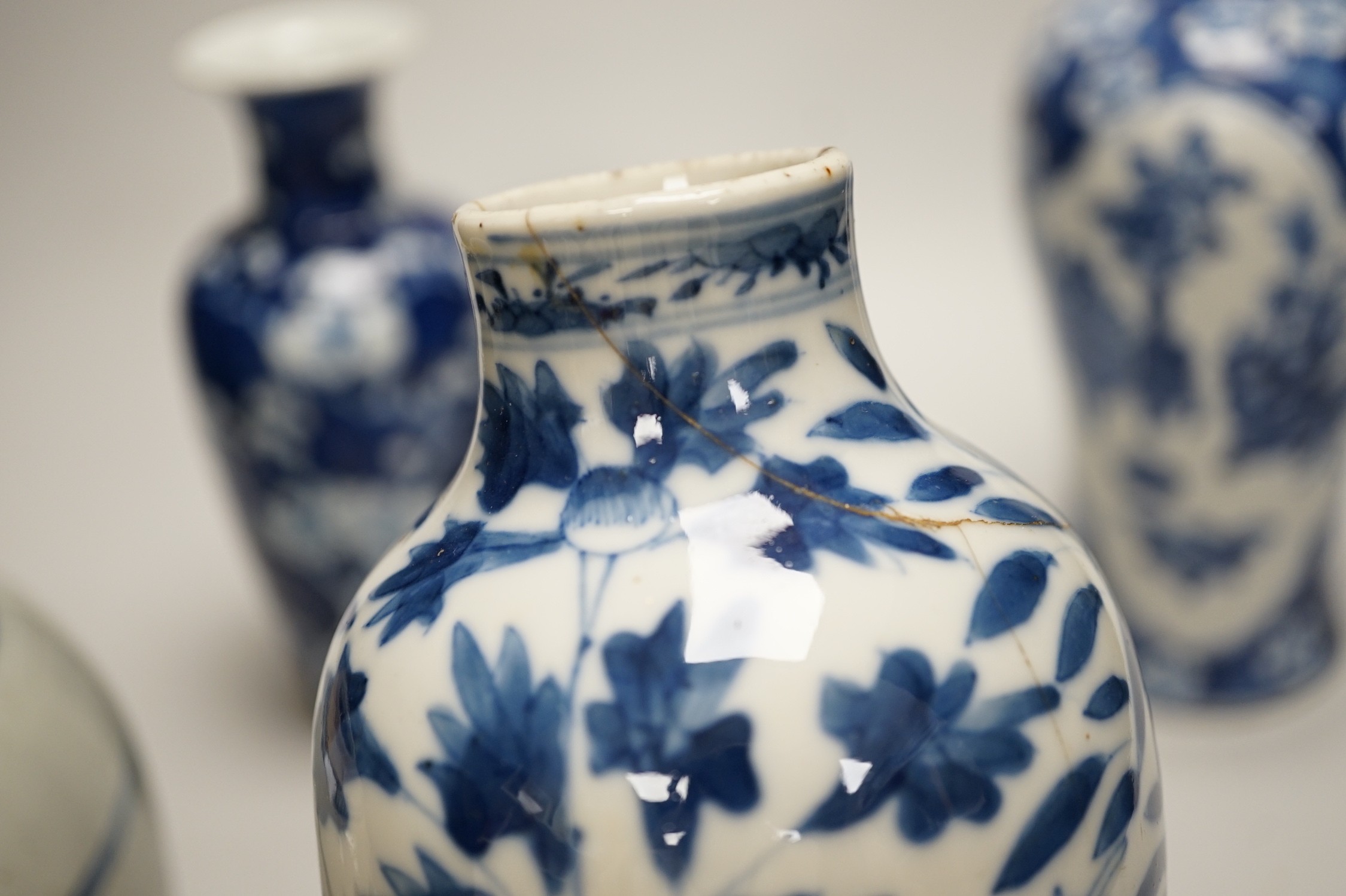 Three Chinese blue and white vases and a similar jar, 19th century, tallest 22.5 cm